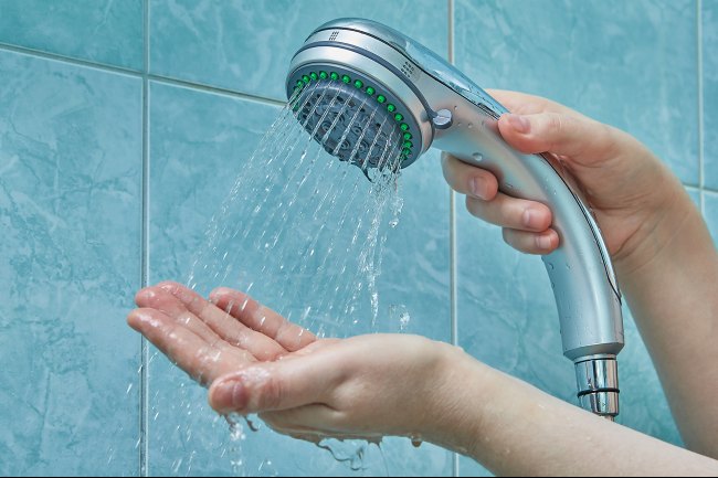Holding a running shower head